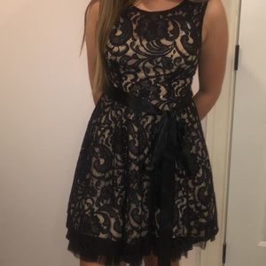 Black lace dress with nude slip underneath